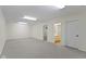 Spacious finished basement with neutral carpet and bright overhead lighting at 1941 Orchard Ct, Carmel, IN 46280