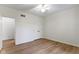 Bright bedroom with laminate flooring, ceiling fan, and closet for ample storage at 1941 Orchard Ct, Carmel, IN 46280