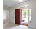 Foyer area with decorative light fixture, neutral walls and tile flooring at 1941 Orchard Ct, Carmel, IN 46280