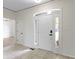 Foyer area featuring neutral walls, white trim and tile flooring at 1941 Orchard Ct, Carmel, IN 46280