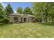 Inviting front yard showcasing the home's stone accents, well-kept lawn, and tidy landscaping at 1941 Orchard Ct, Carmel, IN 46280