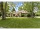 Spacious front yard with lush grass and mature trees providing shade and curb appeal at 1941 Orchard Ct, Carmel, IN 46280