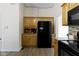 Modern kitchen with stainless steel appliances, wooden cabinets, and granite countertops at 1941 Orchard Ct, Carmel, IN 46280