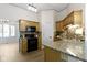 Bright kitchen with granite countertops, stainless steel appliances, and wooden cabinets at 1941 Orchard Ct, Carmel, IN 46280