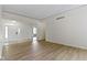 Open-concept living space with light wood floors and a view of the front door at 1941 Orchard Ct, Carmel, IN 46280
