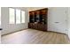 Living Room featuring a large wooden bookcase with a window view and light wood flooring at 1941 Orchard Ct, Carmel, IN 46280