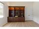 Living Room featuring a large wooden bookcase with a window view at 1941 Orchard Ct, Carmel, IN 46280
