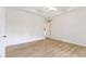 Bright main bedroom featuring tray ceilings and wood-style flooring at 1941 Orchard Ct, Carmel, IN 46280