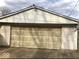 Spacious garage with a large overhead door at 21 Reo St, Columbus, IN 47201