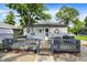 Charming backyard with deck, perfect for outdoor entertaining with table and chairs at 2150 S Emerson Ave, Indianapolis, IN 46203