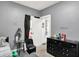 Cozy bedroom featuring neutral grey walls and minimal decor with a side table at 2150 S Emerson Ave, Indianapolis, IN 46203
