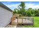 Wooden deck with stairs and railings, offering a comfortable outdoor space adjacent to the home at 2150 S Emerson Ave, Indianapolis, IN 46203