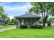 Charming home featuring a cozy front porch, well-manicured lawn, and inviting curb appeal at 2150 S Emerson Ave, Indianapolis, IN 46203