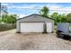 View of a detached one car garage with an white door and gray siding at 2150 S Emerson Ave, Indianapolis, IN 46203