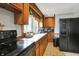 The kitchen includes stainless steel appliances, oak cabinets, tile flooring and countertop space at 2150 S Emerson Ave, Indianapolis, IN 46203