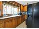 The kitchen features oak cabinets, stainless steel appliances, tile floors and plenty of counter space at 2150 S Emerson Ave, Indianapolis, IN 46203