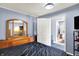 Main bedroom has hard surface floors and a large dresser with mirror at 2150 S Emerson Ave, Indianapolis, IN 46203