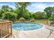 Backyard pool surrounded by a wooden deck, offering a relaxing and private outdoor experience at 2150 S Emerson Ave, Indianapolis, IN 46203