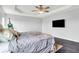 Spacious bedroom with dark wood floors, tray ceiling, and a wall-mounted TV at 2473 Shadow Bend Dr, Columbus, IN 47201