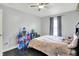 Cozy bedroom featuring a ceiling fan and plenty of natural light at 2473 Shadow Bend Dr, Columbus, IN 47201