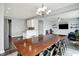 Open-concept dining and living area with modern lighting and decor at 2473 Shadow Bend Dr, Columbus, IN 47201
