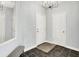 Welcoming entryway with ceramic tile flooring, a mirror, and modern lighting fixture at 2473 Shadow Bend Dr, Columbus, IN 47201