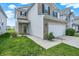 Well-manicured front yard with a two-story home featuring stone and siding, plus an attached two-car garage at 2473 Shadow Bend Dr, Columbus, IN 47201
