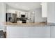 Bright kitchen with stainless steel appliances and sleek breakfast bar counter at 2473 Shadow Bend Dr, Columbus, IN 47201