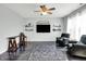 Cozy living room features hardwood floors, a ceiling fan and lots of natural light at 2473 Shadow Bend Dr, Columbus, IN 47201