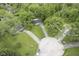 Birds-eye view of houses at the end of a quiet cul-de-sac, with long driveways and green lawns at 2807 Westleigh Dr, Indianapolis, IN 46268