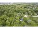 An aerial view of homes scattered among dense trees in a mature, green neighborhood at 2807 Westleigh Dr, Indianapolis, IN 46268