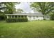 Backyard with a large lawn and screen room at 2807 Westleigh Dr, Indianapolis, IN 46268