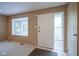Inviting living space with neutral tones, a bay window, and stylish entryway with white trim at 2807 Westleigh Dr, Indianapolis, IN 46268