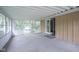 Open screened-in porch with views of the backyard and an open doorway to the house at 2807 Westleigh Dr, Indianapolis, IN 46268