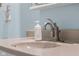 Close up of a modern bathroom sink with a stylish faucet and soap dispenser at 2810 Bittersweet Blvd, Columbus, IN 47203