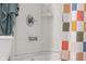 Clean and functional bathroom with white tiled walls and colorful shower curtain at 2810 Bittersweet Blvd, Columbus, IN 47203