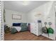 A cozy bedroom features wood floors, a cheerful message, and colorful decor at 2810 Bittersweet Blvd, Columbus, IN 47203