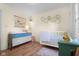 Adorable Bedroom with white crib, changing table, and vintage-style decor at 2810 Bittersweet Blvd, Columbus, IN 47203