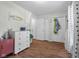 Bright bedroom with wood floors, white trim, and view into closet and hallway at 2810 Bittersweet Blvd, Columbus, IN 47203