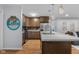 Stylish kitchen with wood cabinets, island with hanging lights, and stainless steel appliances at 2810 Bittersweet Blvd, Columbus, IN 47203