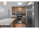 Bright kitchen with stainless appliances, stylish wood cabinets, and modern countertops at 2810 Bittersweet Blvd, Columbus, IN 47203