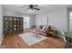 Bright and airy living room with a statement wall decoration and lots of storage at 2810 Bittersweet Blvd, Columbus, IN 47203
