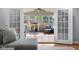 Bright sunroom with lots of natural light, modern ceiling fan, and play area for children at 2810 Bittersweet Blvd, Columbus, IN 47203