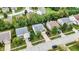 Aerial view of the home with well-manicured lawns, mature trees, and neighborhood at 3221 Holt St, Whiteland, IN 46184
