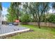 Features a spacious deck with outdoor seating, a grill, and a playhouse in a fenced yard at 3221 Holt St, Whiteland, IN 46184