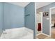 Bathroom featuring a separate tub and shower for a spa-like experience at 3221 Holt St, Whiteland, IN 46184
