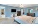 Light-filled bedroom featuring a neutral color scheme and modern television at 3221 Holt St, Whiteland, IN 46184
