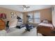 Bedroom featuring workout equipment, desk, and bed, providing a versatile space for fitness and relaxation at 3221 Holt St, Whiteland, IN 46184