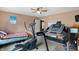 Bedroom with exercise equipment, including elliptical and treadmill, providing a convenient fitness area at 3221 Holt St, Whiteland, IN 46184