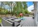 Relaxing deck with sectional, seating, grill and play area perfect for entertaining at 3221 Holt St, Whiteland, IN 46184